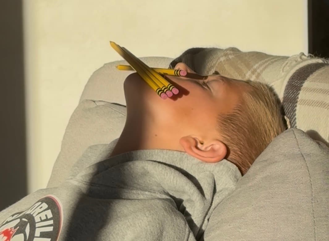 Most Pencils Balanced on the Chin