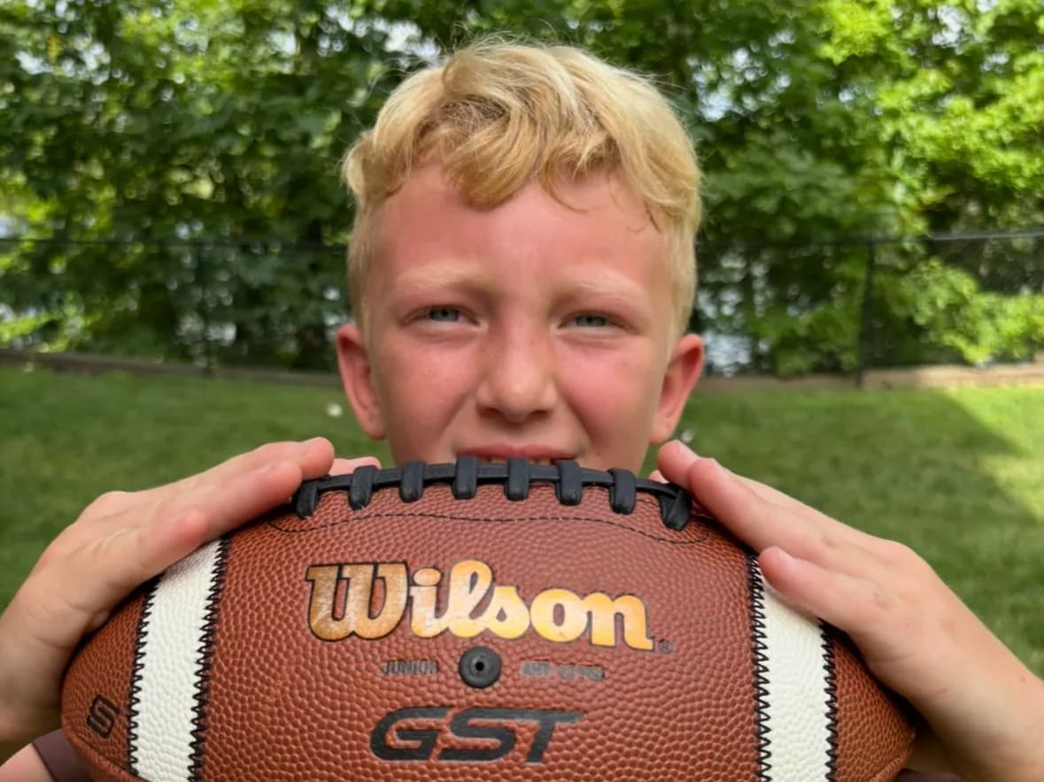 Most Football Catches while Bouncing on a Pogo Stick